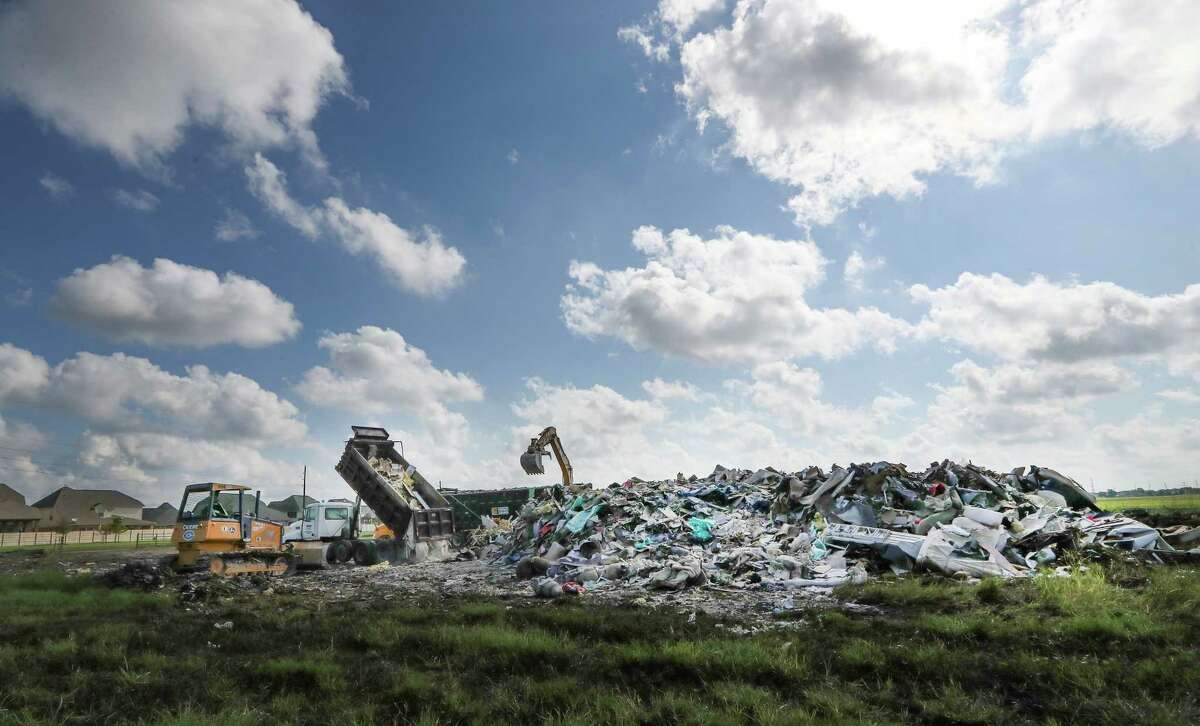A large debris field near the corner of Beechnut and S. Mason in Richmond. One of the MUD (municipal utility districts) has set up a dumping area on an open lot Friday, Sept. 22, 2017, in Richmond.