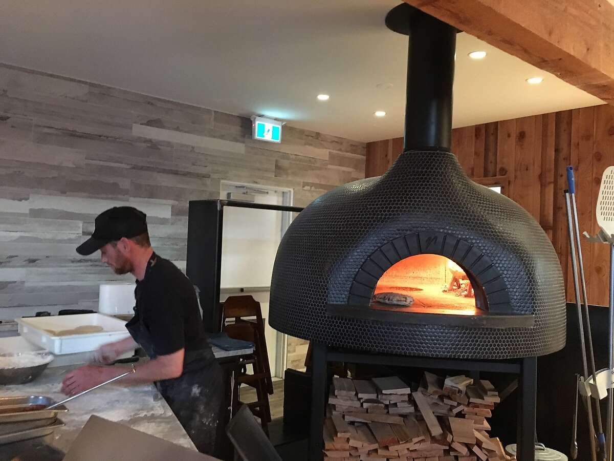 The wood-burning oven at Tofino Resort & Marina turns out pizzas for both restaurants at the remodeled hotel and docks on the ocean side of Vancouver Island, British Columbia.