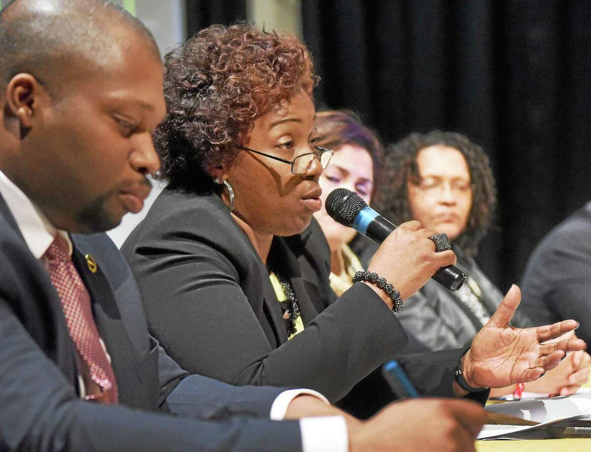 (Peter Hvizdak - New Haven Register) ¬ State Senator Gary Holder-Winfield, left, and State Representative Robyn Porter, second from left, during a panel discussion on "Social Justice in a PostMichael Brown Era" with political, religious, social and professional leaders of the New Haven area community during the Partners for Progress 18th Annual Sigma Gamma Rho Sorority, Inc. YouthSymposium at Hill Regional Career Magnet School in New Haven Saturday, March 14, 2015 sponsored by the Iota Chi Sigma Chapter of the Sigma Gamma Rho Sorority.