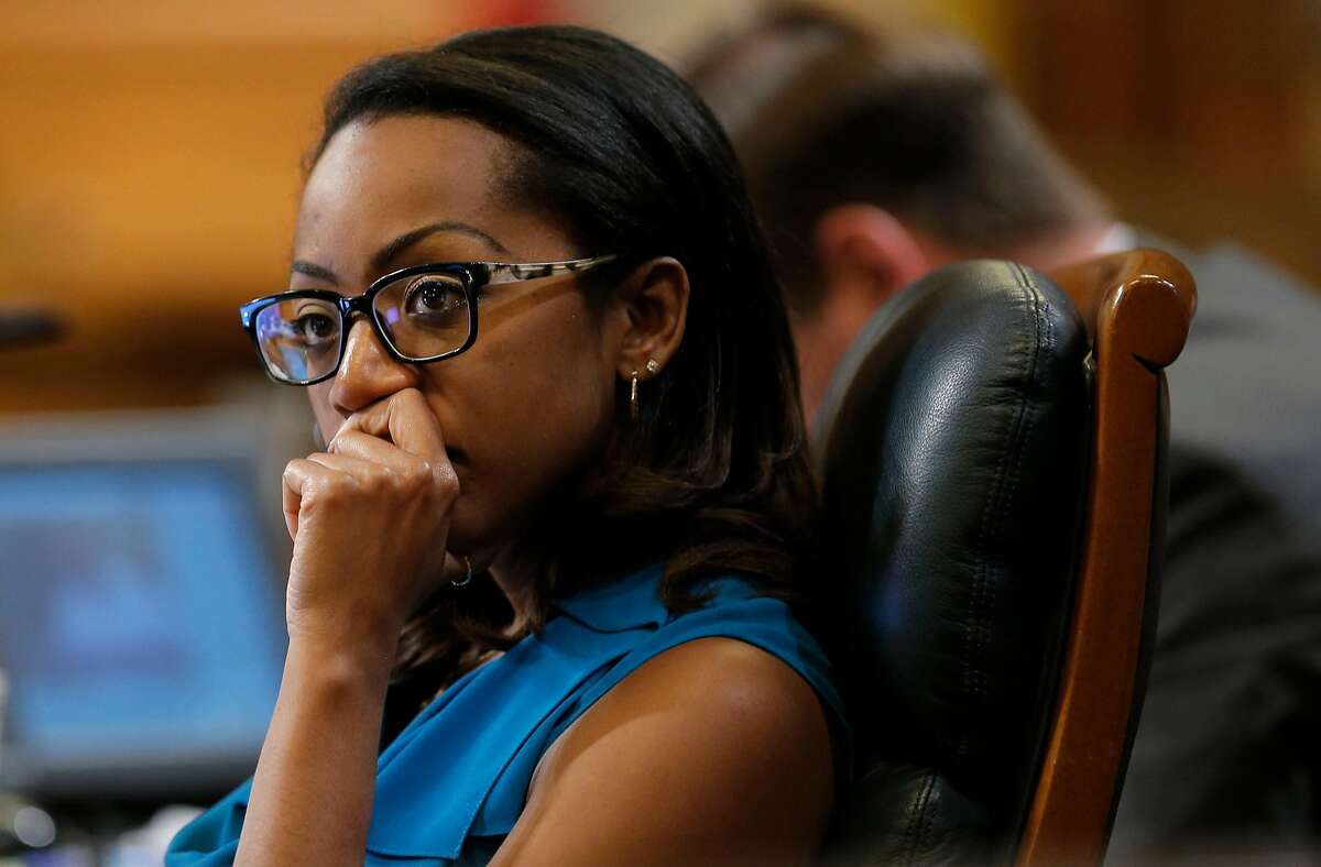 Supervisor Malia Cohen listens to fellow Supervisors as they discuss the Transbay Transit District special tax assessment, during the Board of Supervisors their Tuesday Sept. 23, 2014 meeting at City Hall in San Francisco, Calif.