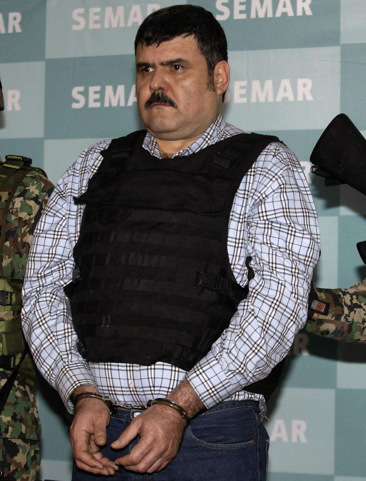 Jorge Eduardo Costilla Sanchez, aka "El Coss," is presented to the media in Mexico City in September 2012 after his capture. Costilla has pleaded guilty to conspiracy drug charges and assault, federal authorities said Tuesday.