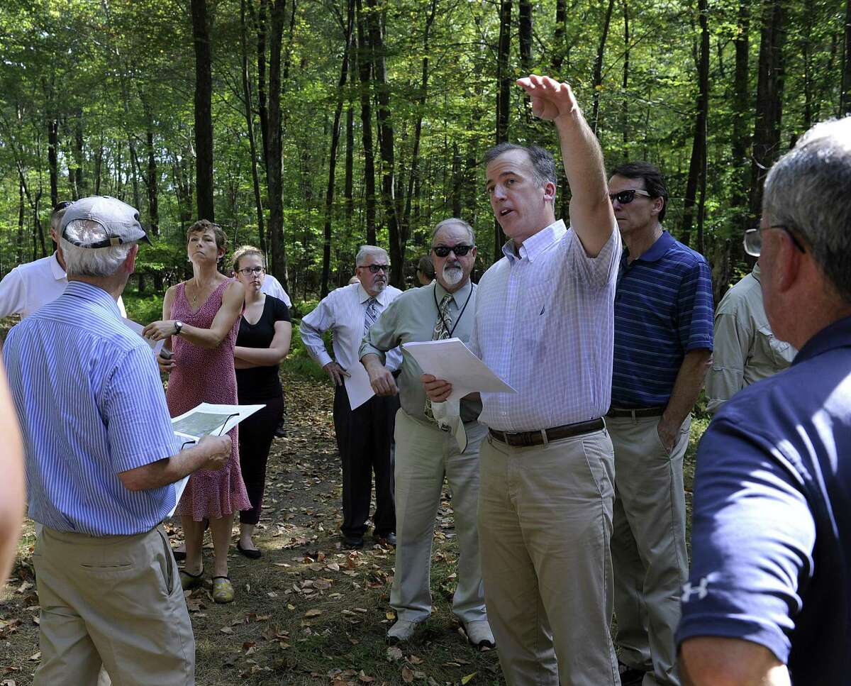 Joel Lindsay, with Ameresco Candlewood Solar LLC, leads a walking tour for the state Siting Council of the area where there is a proposal to build solar panels on Candlewood Mountain in New Milford, Tuesday, Sept. 26, 2017.