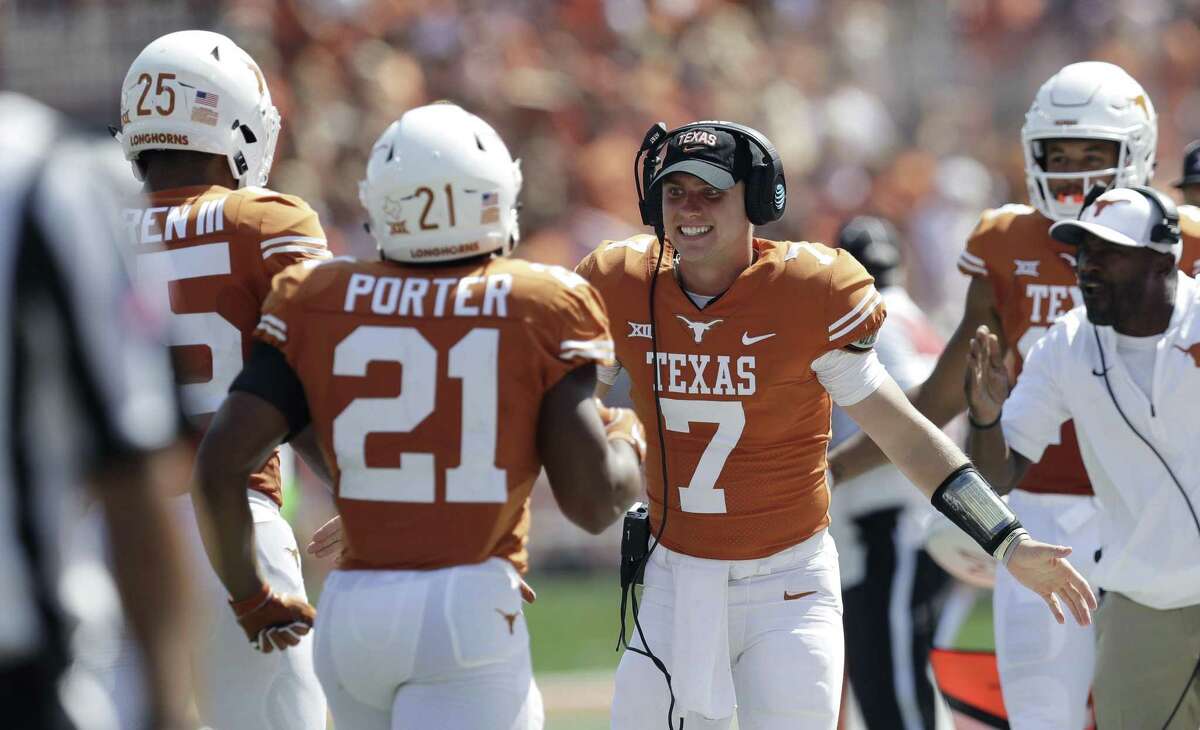 Texas quarterback Shane Buechele (7) celebrates with teammates after a score against San Jose State during the first half of an NCAA college football game, Saturday, Sept. 9, 2017, in Austin. Texas won 56-0.