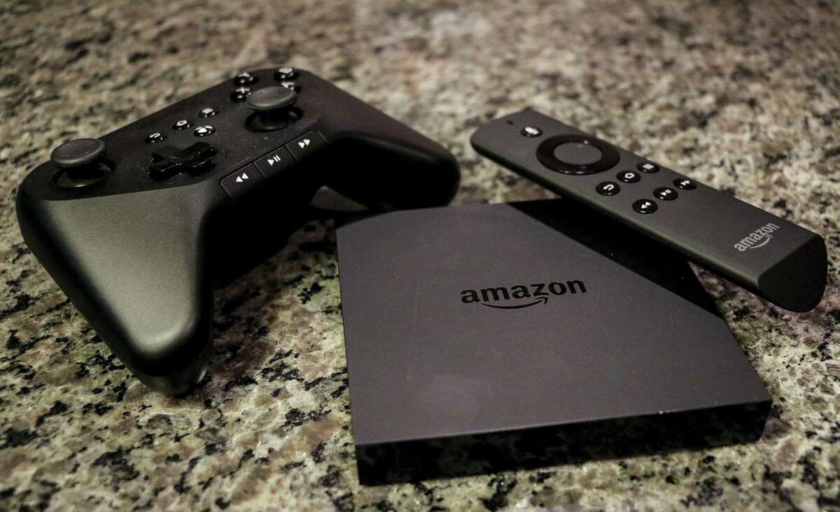 This 2014 file photo shows the Amazon Fire TV, a product for streaming popular video services, apps and games in high-definition, in Decatur, Ga. Amazon begins its foray into live streaming of NFL games Thursday night, Sept. 28, 2017, when the company will air the game between the Chicago Bears and Green Bay Packers on its Prime Video service as another option to the traditional broadcasts on CBS and the NFL Network.
