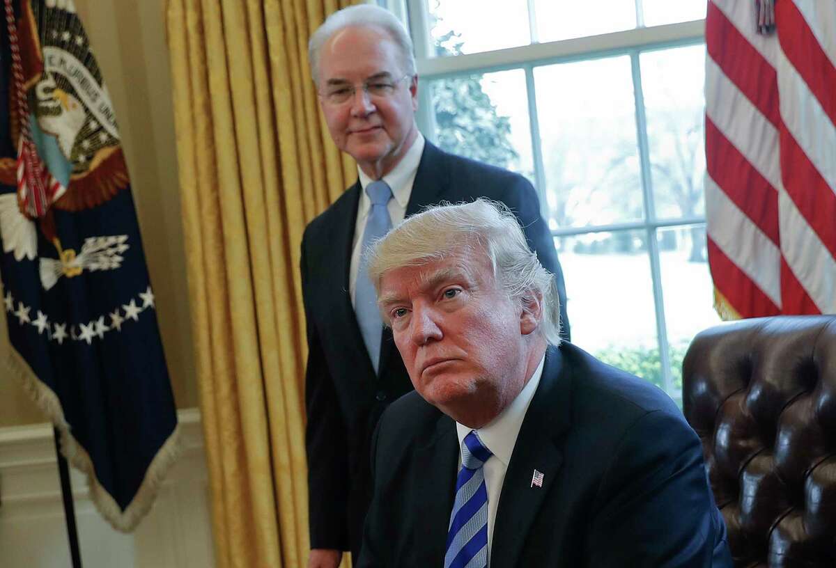 FILE - In this March 24, 2017 file photo, President Donald Trump with Health and Human Services Secretary Tom Price are seen in the Oval Office of the White House in Washington. Congress is launching a wide-ranging examination of air travel by high-ranking Trump administration officials. The House Oversight and Government Reform committee is following up on reports that health secretary Tom Price used pricey charters when cheaper commercial flights would have done. (AP Photo/Pablo Martinez Monsivais, File)