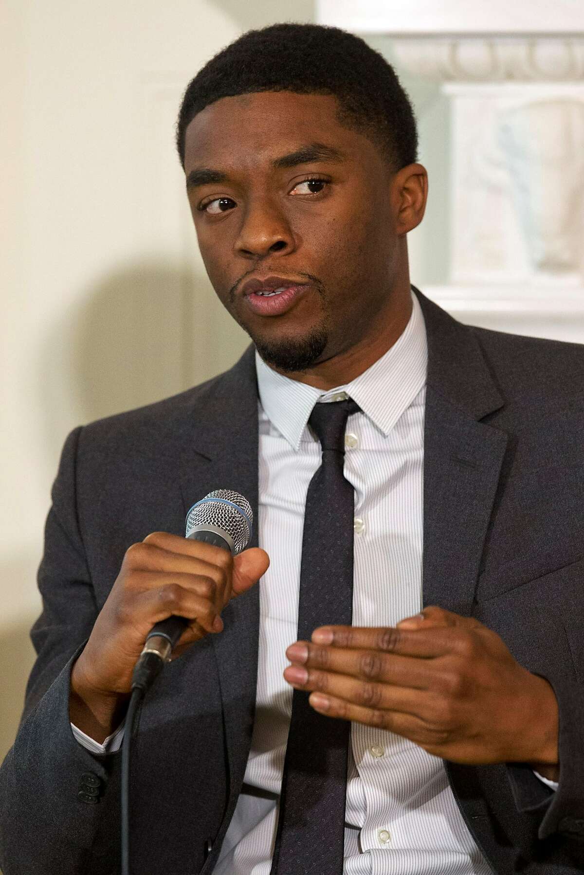 Actor Chadwick Boseman, who plays baseball great Jackie Robinson in the movie "42" speaks on a panel, hosted by first lady Michelle Obama, of the cast and crew of the movie, Tuesday, April 2, 2013, in the State Dining Room of the White House in Washington.