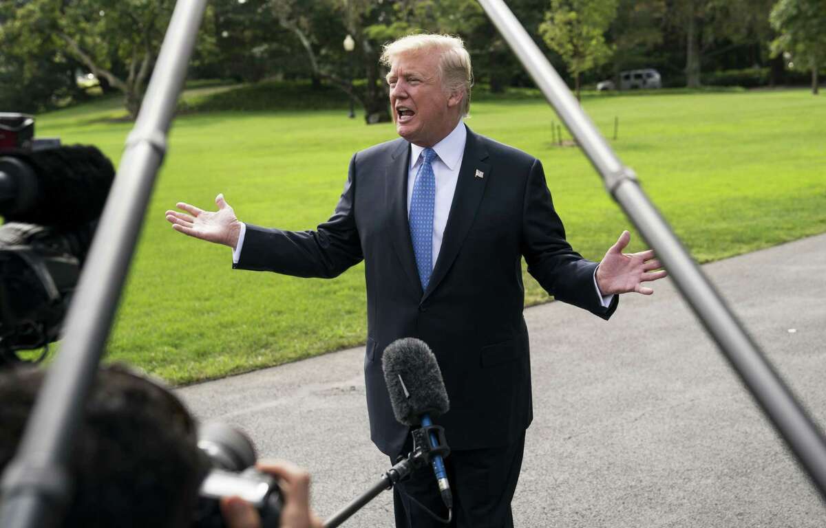 President Donald Trump speaks with reporters as he departed the White House in Washington, bound for an event in Indiana, Sept. 27, 2017. The Trump administration on Wednesday proposed the most sweeping changes to the federal tax code in decades; Trump is scheduled to discuss the proposal at a Farm Bureau building in Indianapolis. (Doug Mills/The New York Times)