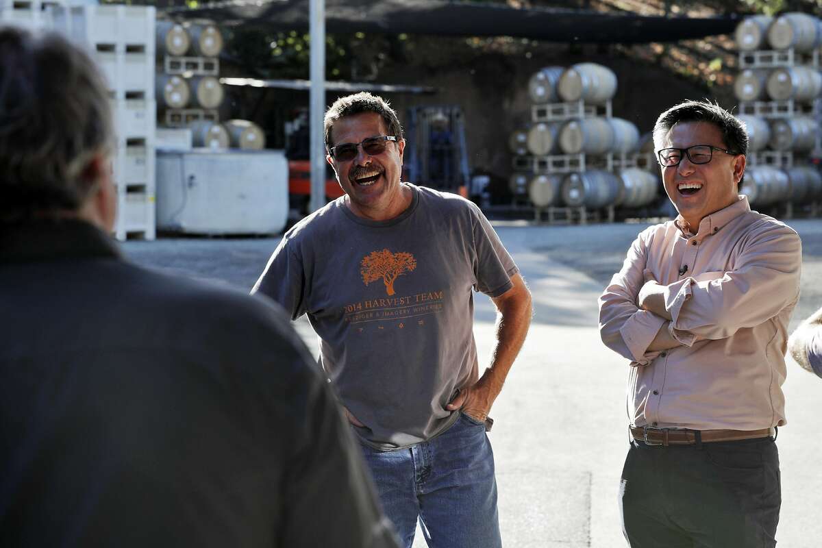 John Chiang, right, laughs as he takes a tour of the Benziger Family Winery with Joe Benziger, center, and Mark Burningham, left, for his campaign for governor in Glen Ellen, Calif., on Tuesday, September 26, 2017.