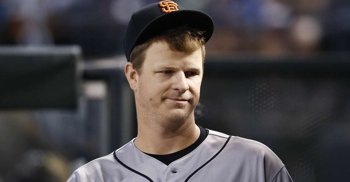 San Francisco Giants pitcher Matt Cain walks through the dugout during the third inning of a baseball game against the Arizona Diamondbacks Wednesday, Sept. 27, 2017, in Phoenix. San Francisco pitcher Matt Cain says he'll retire after his start at home on Saturday against San Diego. The 32-year-old Cain informed teammates of his decision in a closed meeting before Wednesday's game at Chase Field against the Arizona Diamondbacks. (AP Photo/Ross D. Franklin)