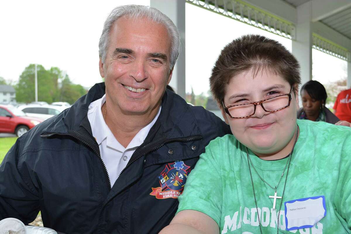 May 16, 2014 - Mentor and Middletown Fire Marshal Al Santostefano and his mentee Nathan Ostrowski at the Middlesex County Chamber of Commerce Mentor Program end of the year picnic at Battell Hall Picnic Grove at Connecticut Valley Hospital Friday afternoon. (Catherine Avalone/The Middletown Press)