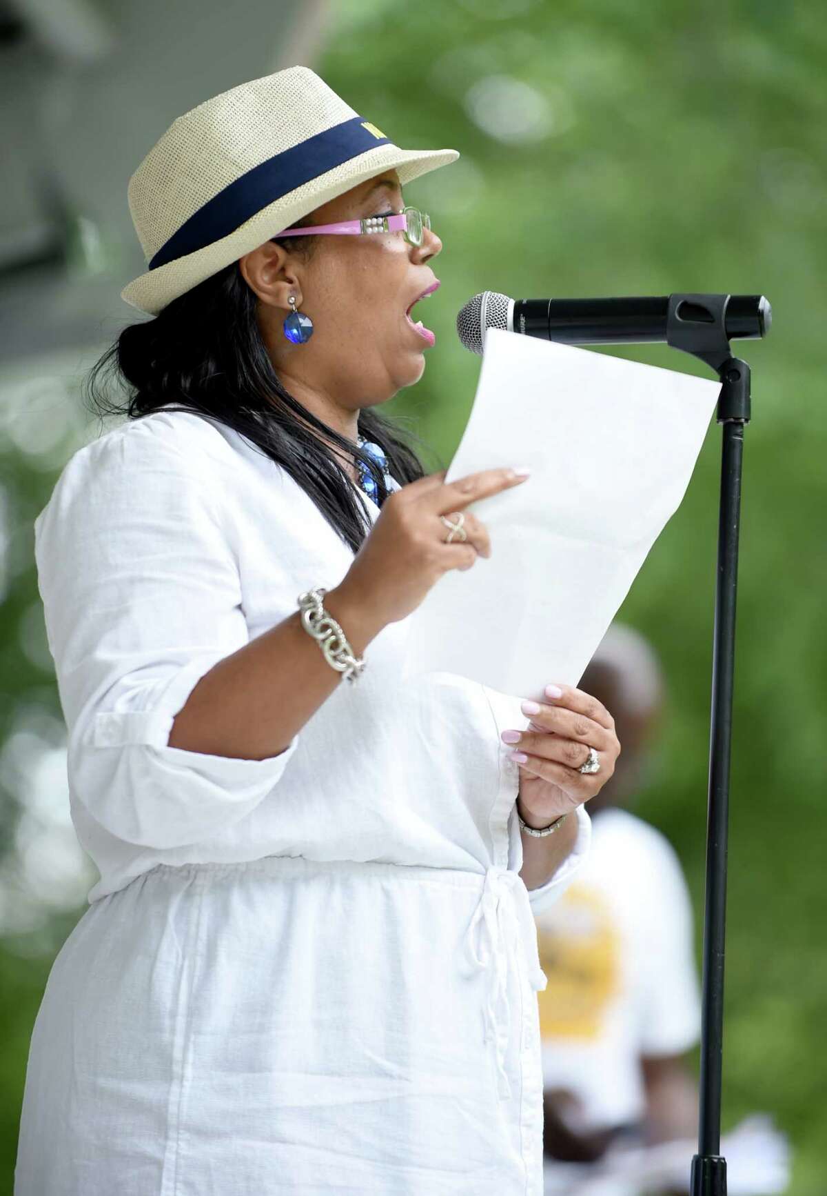 Dori Dumas, president of the Greater New Haven branch of the NAACP, speaks at a rally on the New Haven Green following a Silent Protest Parade that started on Dixwell Ave. on 7/29/2017. "Juneteenth is a celebration of history, freedom and liberation celebrated annually on June 19 to commemorate the end of slavery for the blacks enslaved in Texas who learned about the Emancipation Proclamation on June 19, 1865.  On this day in 1865, 2.5 years after the proclamation, Union soldiers delivered the news to the still-enslaved people, and their immediate reaction was jubilation and celebration. The celebration and honor of the right of freedom have been upheld by many of the African Americans in our country.    Juneteenth marks our country’s second independence day. It is celebrated and emphasizes education and achievement. Still, it is also a time for reflection. It is used as a reminder of the sobering, dark history of slavery, and the continuous fight for equality, justice and civil rights. Although many in the African American Community have celebrated Juneteenth for years, many white Americans are unaware of its existence. President Donald Trump’s original plan to hold a campaign rally on June 19 in Tulsa, Oklahoma, was interpreted by many to be an intentional dousing of gasoline on a burning America. 