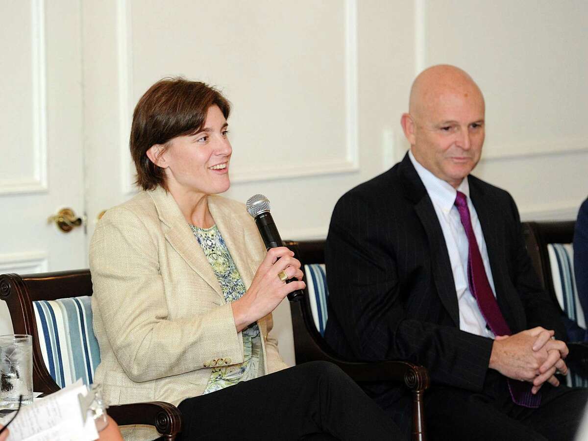 At left, Katie DeLuca, the director of Planning & Zoning for the Town of Greenwich, speaks during a panel discussion regarding "The Real State of Real Estate in Riverside and Old Greenwich" hosted by Greenwich-based financial advisor company Fieldpoint Private at the Riverside Yacht Club, Greenwich, Conn., Wednesday, Sept. 27, 2017.