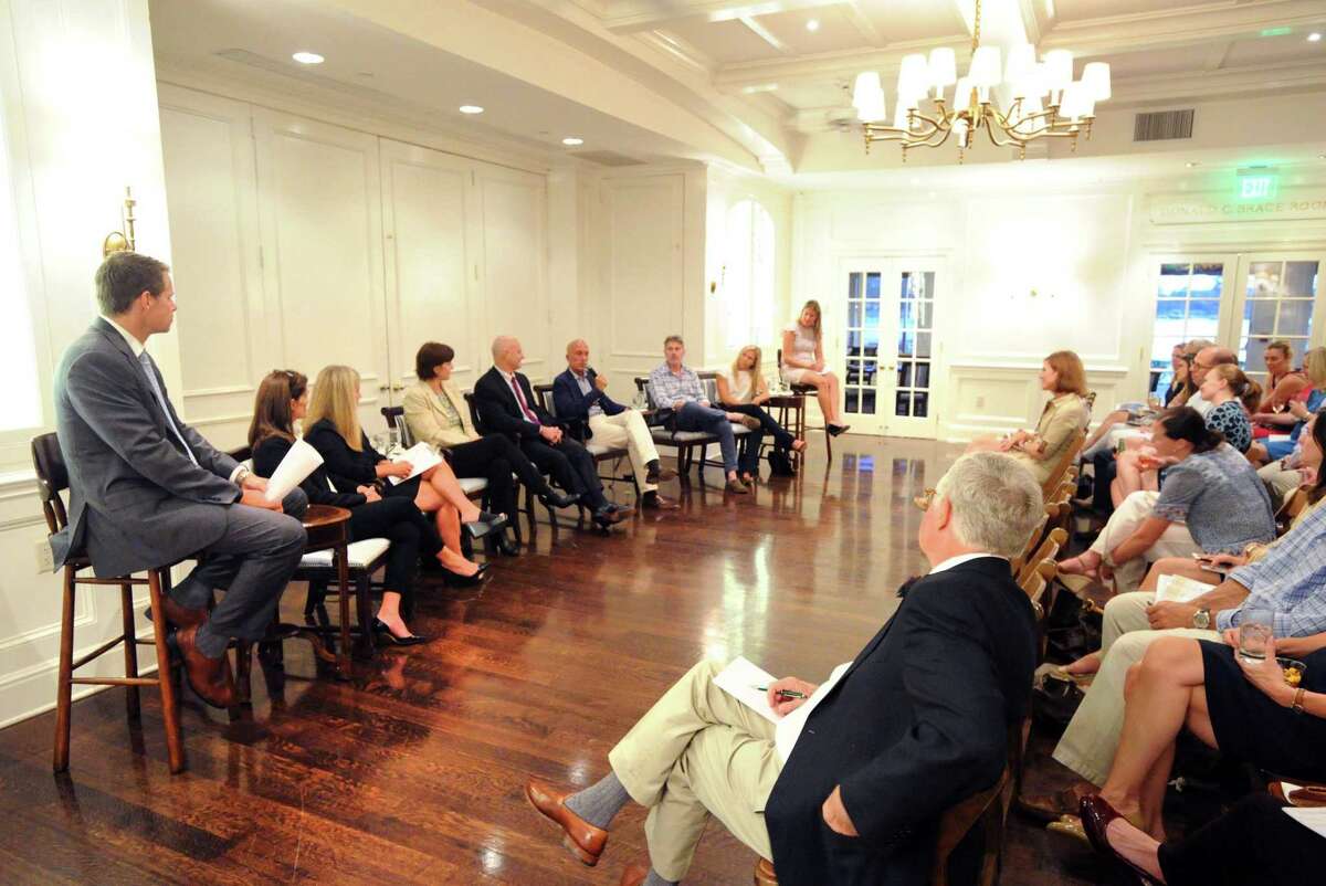 Marcus Zavattaro, left, and Dara Johnson, far right, both managing directors for Fieldpoint Private, a Greenwich-based financial advisor company, lead a panel discussion regarding "The Real State of Real Estate in Riverside and Old Greenwich" at the Riverside Yacht Club, Greenwich, Conn., Wednesday, Sept. 27, 2017.