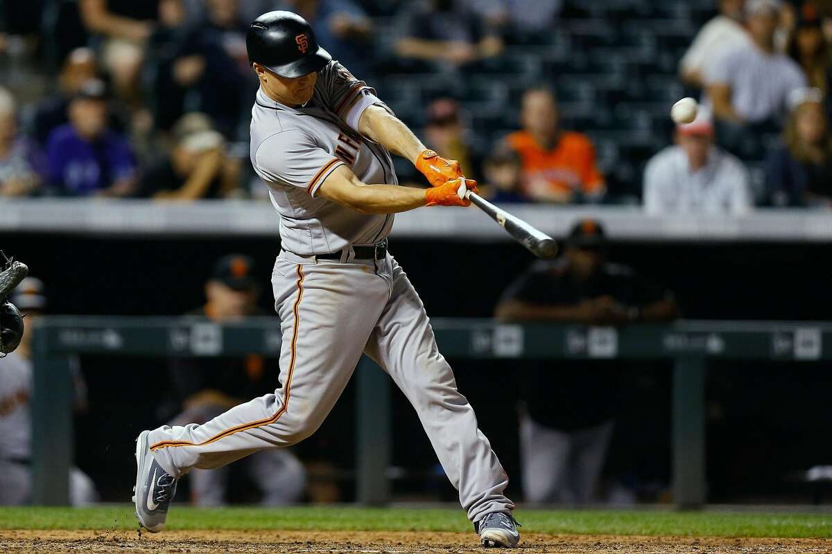 DENVER, CO - SEPTEMBER 6: Nick Hundley #5 of the San Francisco Giants hits a two run home run during the eighth inning against the Colorado Rockies at Coors Field on September 6, 2017 in Denver, Colorado. The Giants defeated the Rockies 11-3. (Photo by Justin Edmonds/Getty Images)