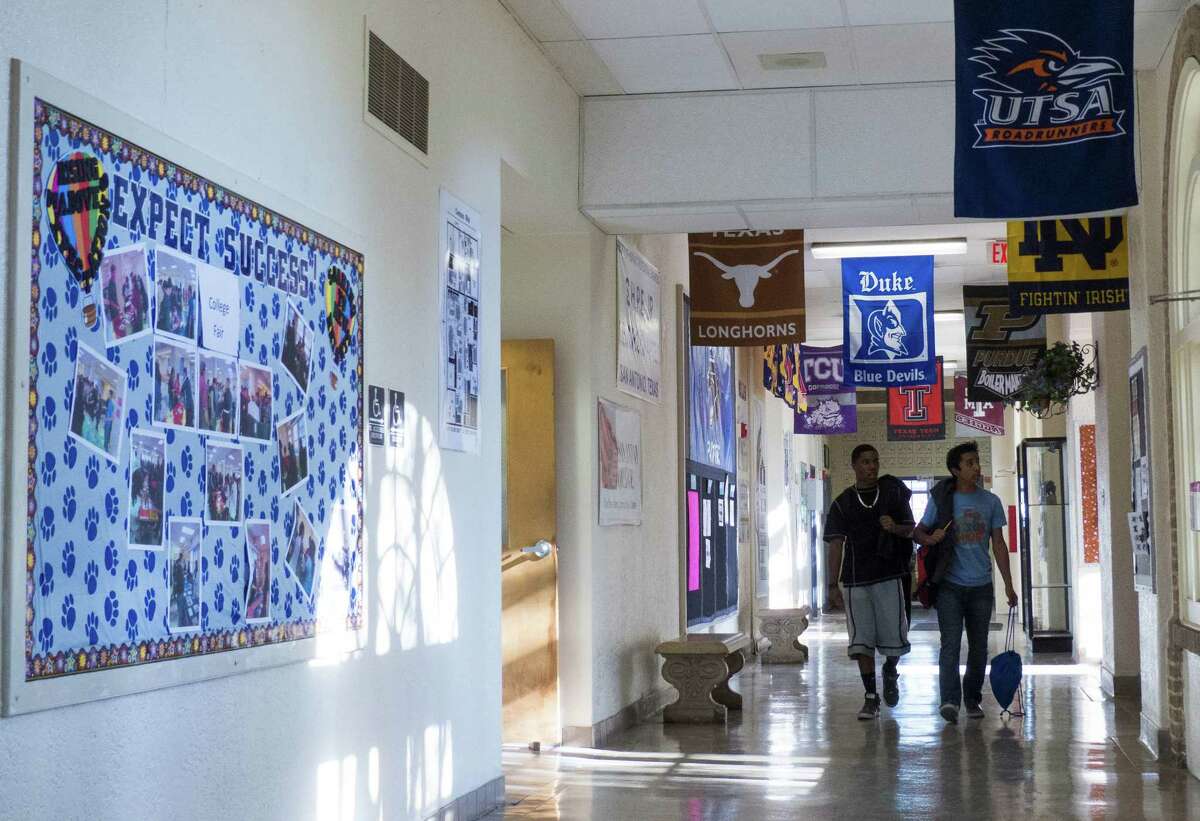 College banners hang in a hallway at Travis Early College in this file photo. The school was named a National Blue Ribbon School by the U.S. Department of Education on Thursday.