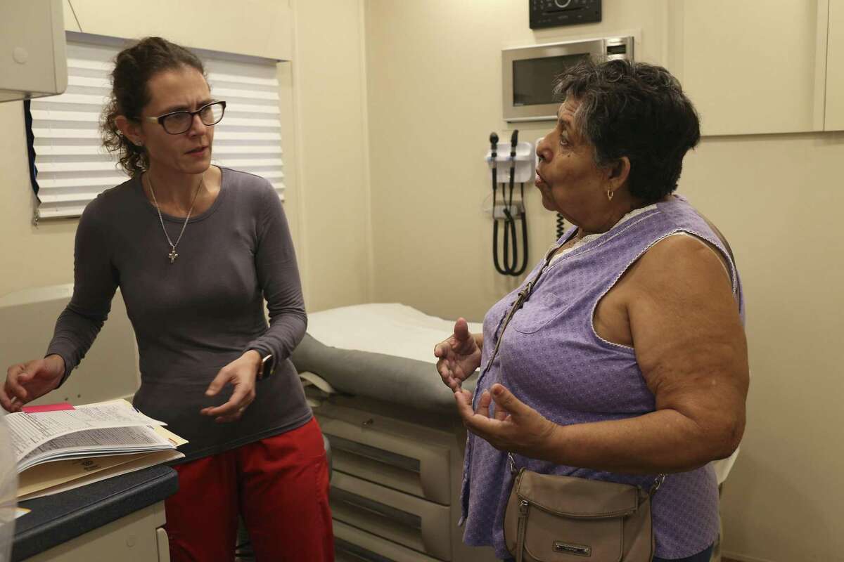 Physician Assistant Brenda Hajj, left, questions Gregoria Resendez, 66, during an examination in the University of Texas Rio Grande Valley School of Medicine Unimovil at the Indian Hills colonia of Mercedes, Texas, Wednesday, Sept. 27, 2017. The program was founded in 2014 to create a substantial health care model for underserved communities. In 2016, Unimovil was added. It has two examination rooms, a laboratory, a restroom and diagnostic equipment.