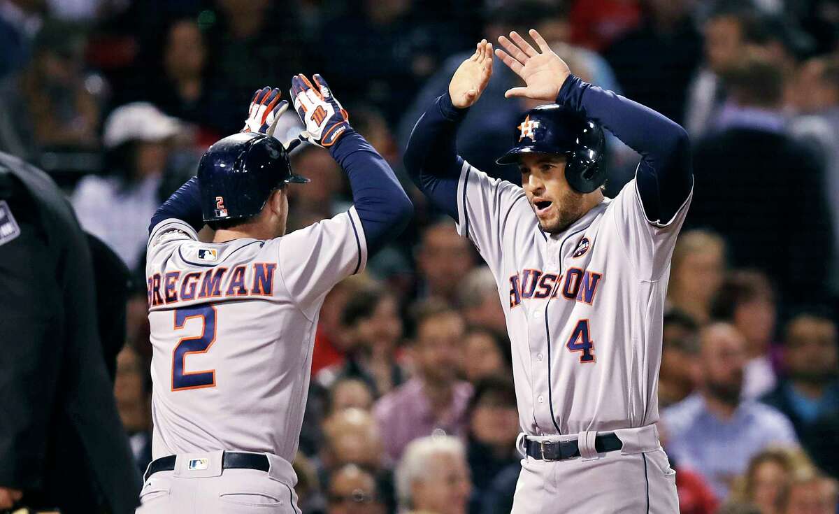 Houston Astros' Alex Bregman (2) is congratulated by George Springer, right, after hitting a two-run home run off Boston Red Sox starting pitcher Eduardo Rodriguez during the second inning of a baseball game at Fenway Park in Boston, Thursday, Sept. 28, 2017. (AP Photo/Charles Krupa)