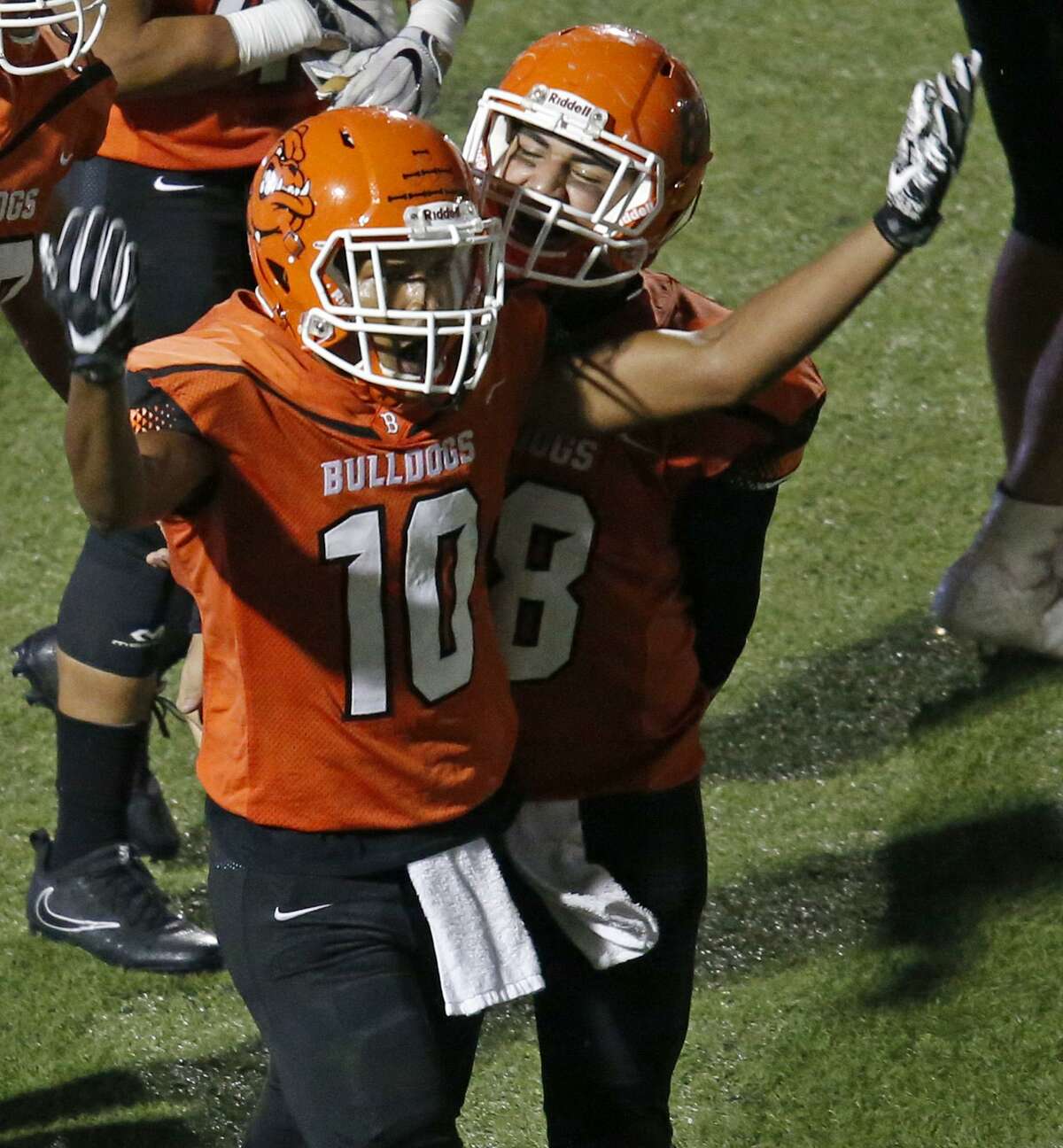 Burbank's Marcus Bolden (left) celebrates with teammate Aaron Trevino after scoring a touchdown against Jefferson during second half action Thursday Sept. 28, 2017 at Alamo Stadium. Burbank won 30-16.