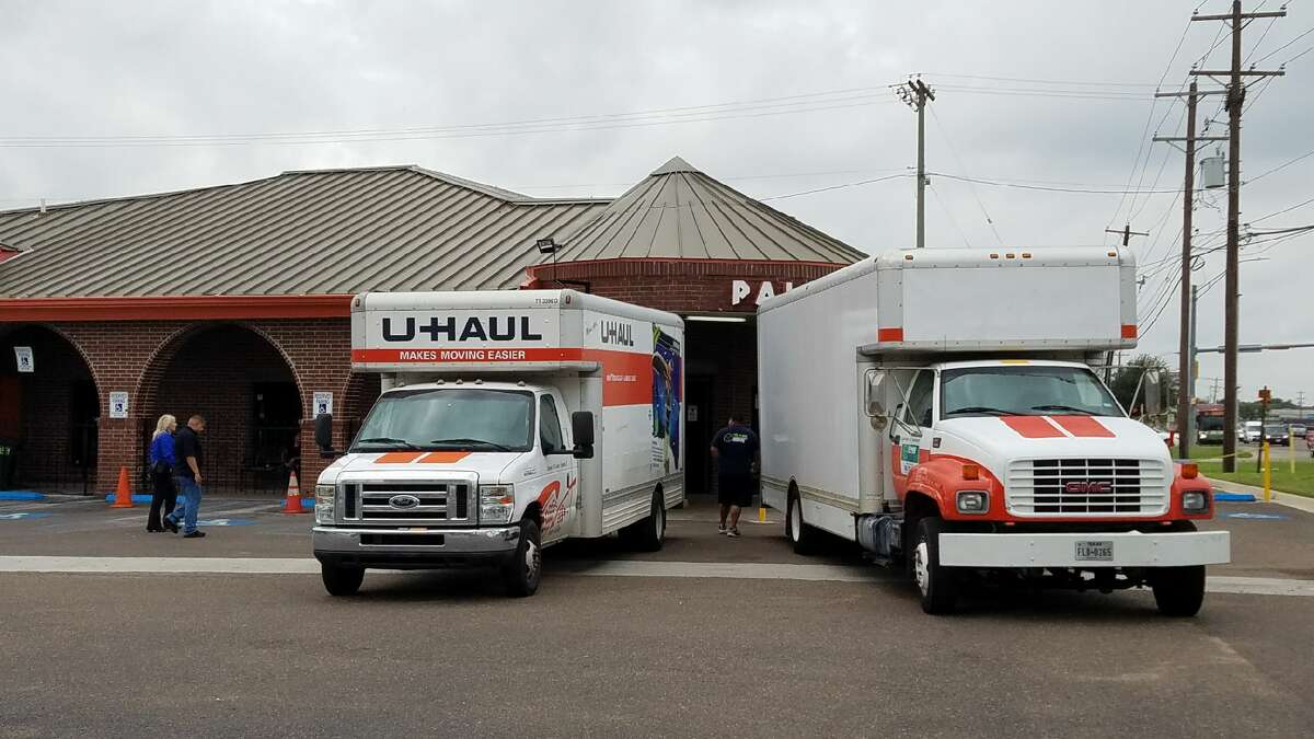 U-Haul trucks line up in front of north Laredo's Palace, where local, state and federal law enforcement agencies simultaneously raided several locations Friday morning.