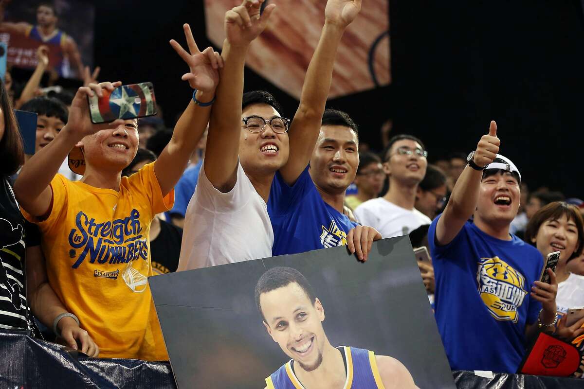 GUANGZHOU, CHINA - SEPTEMBER 03: Fans cheer for American professional basketball NBA player Stephen Curry of the Golden State Warriors who attends a commercial event for Under Armour at Asian Games Stadium on September 3, 2016 in Guangzhou, China. (Photo by Zhong Zhi/Getty Images)