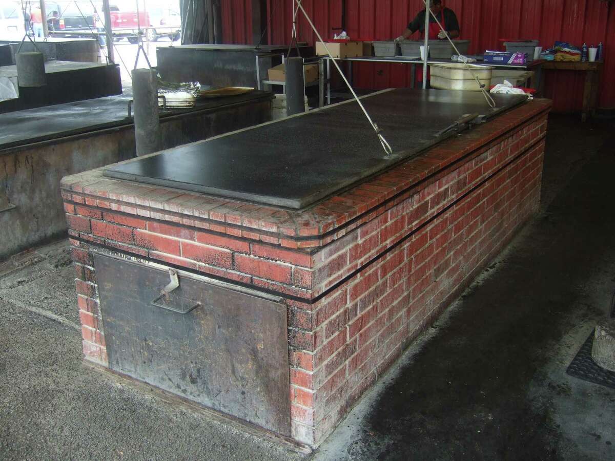 The "barbecue oven" was a progenitor of the brick pits we see in barbecue restaurants today. Shown: The brick pit atÂ Cooper's Old Time Pit Bar-B-Que in Llano