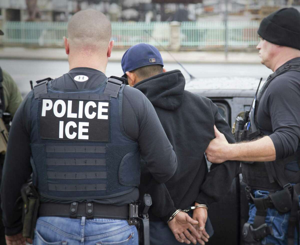 Foreign nationals are arrested during a targeted enforcement operation conducted by U.S. Immigration and Customs Enforcement earlier this year. A 12 percent drop in deportations has occurred even as the number of migrants ICE agents have arrested since Trump took office in January jumped by 43 percent to some 97,500 compared to the same time frame in 2016.