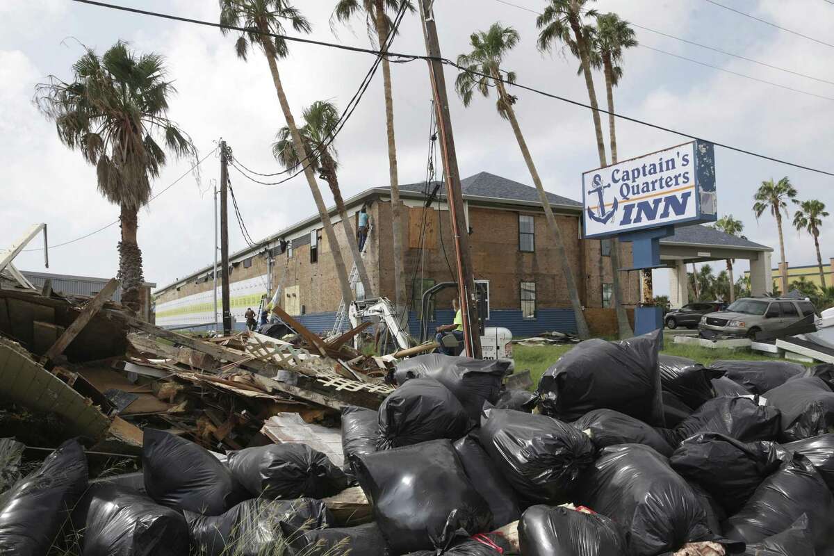 Roads in town are lined with debris piles as building contents are gutted during the recovery from Hurricane Harvey in Port Aransas on September 27, 2017.