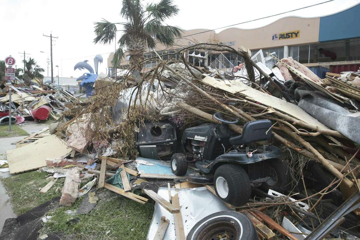 Roads in town are lined with debris piles as building contents are gutted during the recovery from Hurricane Harvey in Port Aransas on September 27, 2017.
