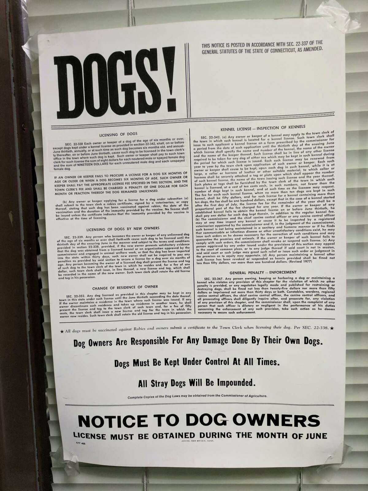 At Greenwich Town Hall, the Connecticut General Statutes regarding dog ownership and licensing are posted on a door across from the women’s restroom on the first floor.