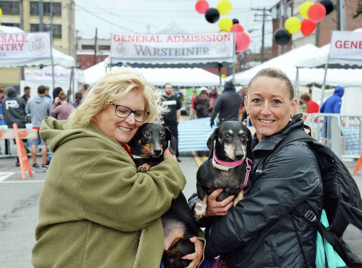 Kathy Giuliano, left, and daughter-in-law Melanie Giuliano with dachshunds Snoopy and Jasmine at the 9th Annual OKTOBERFEST Block Party Saturday Sept. 30, 2017 in Albany, NY. (John Carl D'Annibale / Times Union)