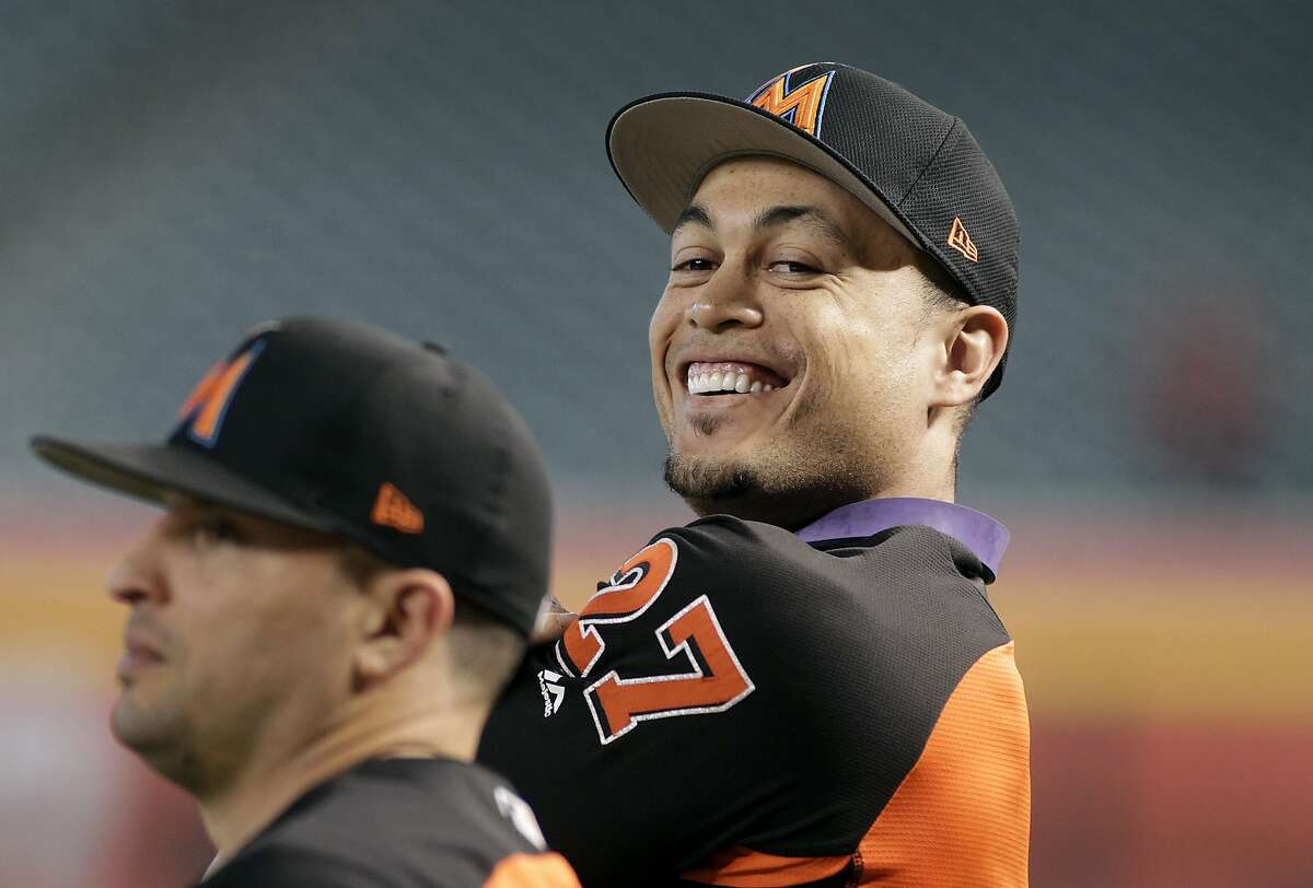 Miami Marlins' Giancarlo Stanton looks on during batting practice