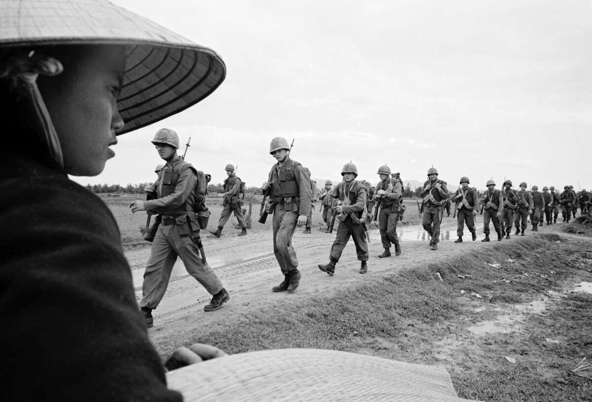 U.S. Marines march in Danang in 1965.