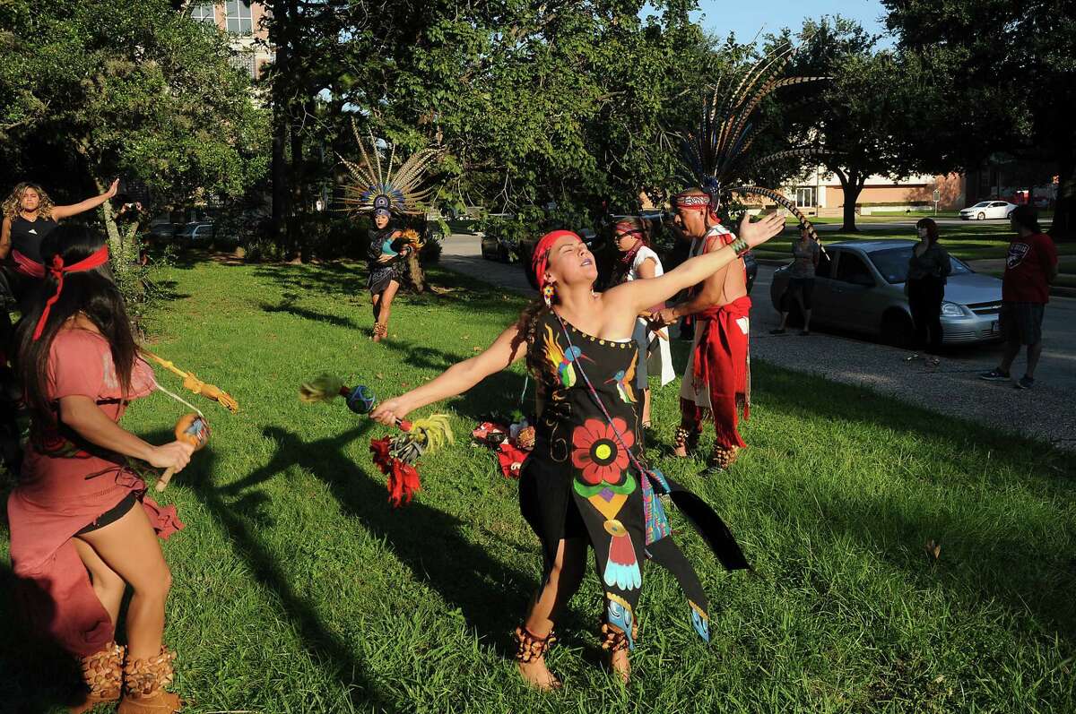 Members of Danza Azteca Taxca Yoloztl perform during a protest and march to recognize Indigenous Peoples day at Bell Park Saturday Sept. 30, 2017.(Dave Rossman Photo)