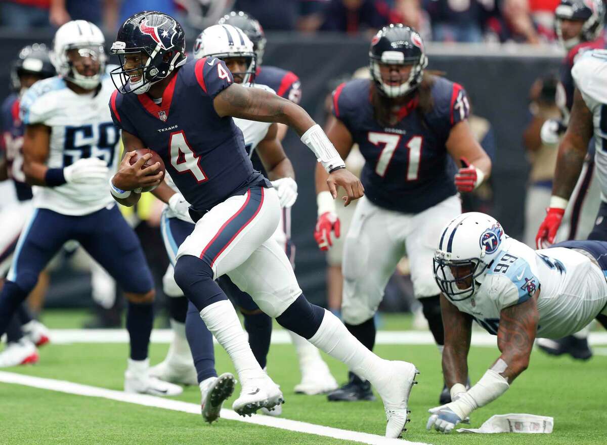 Houston Texans quarterback Deshaun Watson (4) runs p-ast Tennessee Titans defensive end Jurrell Casey (99) for a 1-yard touchdown run during the second quarter of an NFL football game at NRG Stadium on Sunday, Oct. 1, 2017, in Houston.