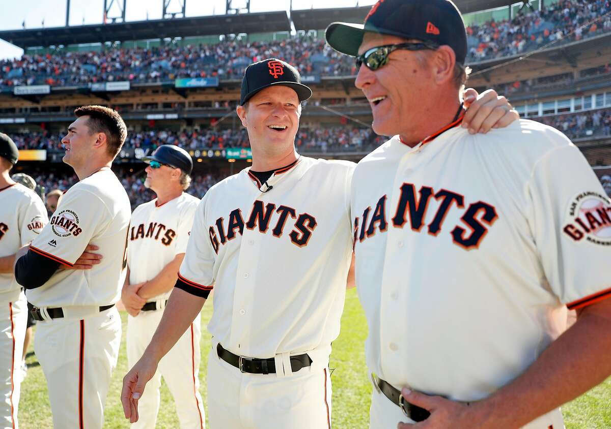 San Francisco Giants' Matt Cain shares laugh with pitching coach, Dave Righetti, before Cain honored for his 13 years with the team after Giants' 5-4 win over San Diego Padres in MLB game at AT&T Park in San Francisco, Calif., on Sunday, October 1, 2017.