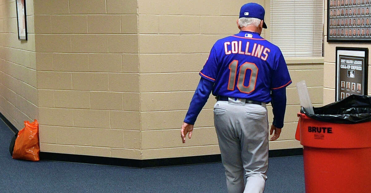 New York Mets manager Terry Collins walks from his office after resigning as manager following a game against the Philadelphia Phillies, Sunday, Oct. 1, 2017, in Philadelphia. New York Mets manager Terry Collins resigned Sunday and will take a position in the team's front office. Collins announced the move after the Mets lost to Philadelphia 11-0 to finish the season. (AP Photo/Derik Hamilton)