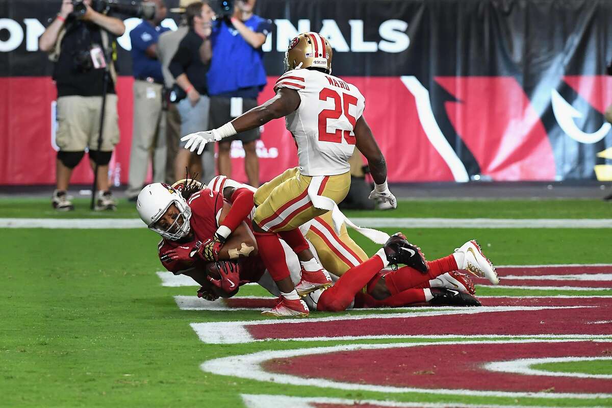 GLENDALE, AZ - OCTOBER 01: Wide receiver Larry Fitzgerald #11 of the Arizona Cardinals makes the game winning catch in the end zone over cornerback Jimmie Ward #25 of the San Francisco 49ers during overtime in the NFL game at the University of Phoenix Stadium on October 1, 2017 in Glendale, Arizona. (Photo by Norm Hall/Getty Images)
