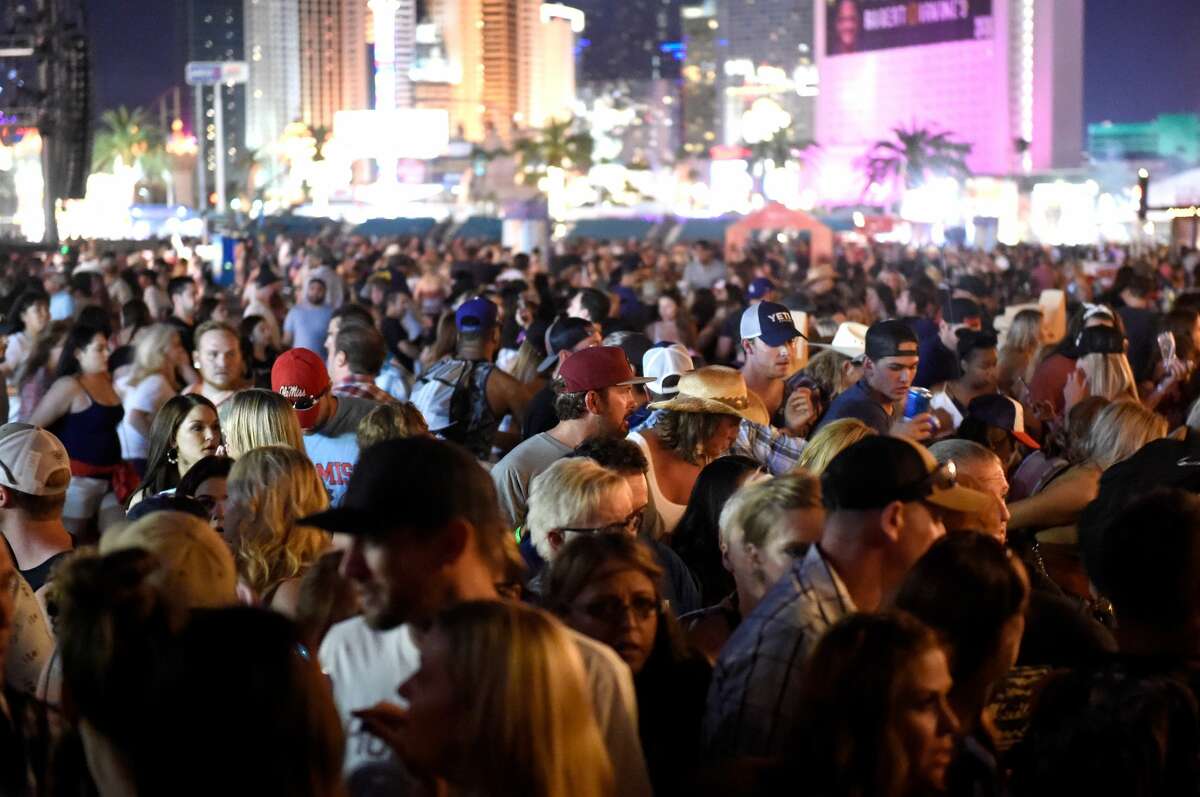A crowd of people at the Route 91 Harvest country music festival after apparent gun fire was heard on October 1, 2017 in Las Vegas, Nevada. There are reports of an active shooter around the Mandalay Bay Resort and Casino. (Photo by David Becker/Getty Images)