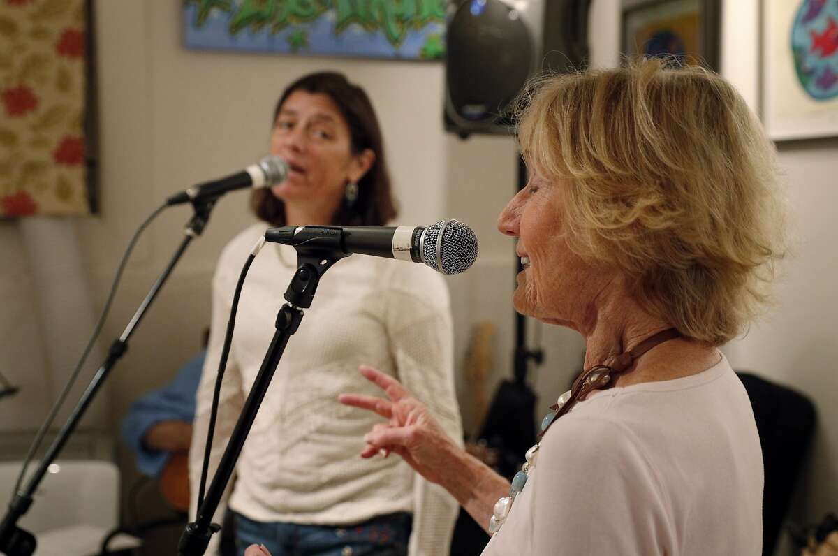 Nancy Bechtle, right, and Tricia Hellman Gibbs, left, during practice for Nancy's group Nancy and the Lambchops at Mick Hellman's home in San Francisco, Calif., on Tuesday, September 19, 2017. Bechtle is Warren Hellman's sister, and the group will be performing at Hardly Strictly Bluegrass music festival in October.