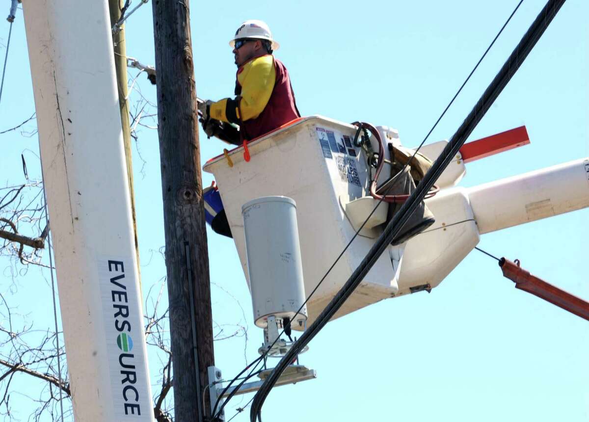 An Eversource crew at work in Westport, Conn., in April 2016. Some 17,600 Eversource electricity customers were enrolled in “arrearage” forgiveness plans last year allowing them to continue receiving service while working out payment plans for amounts past due.