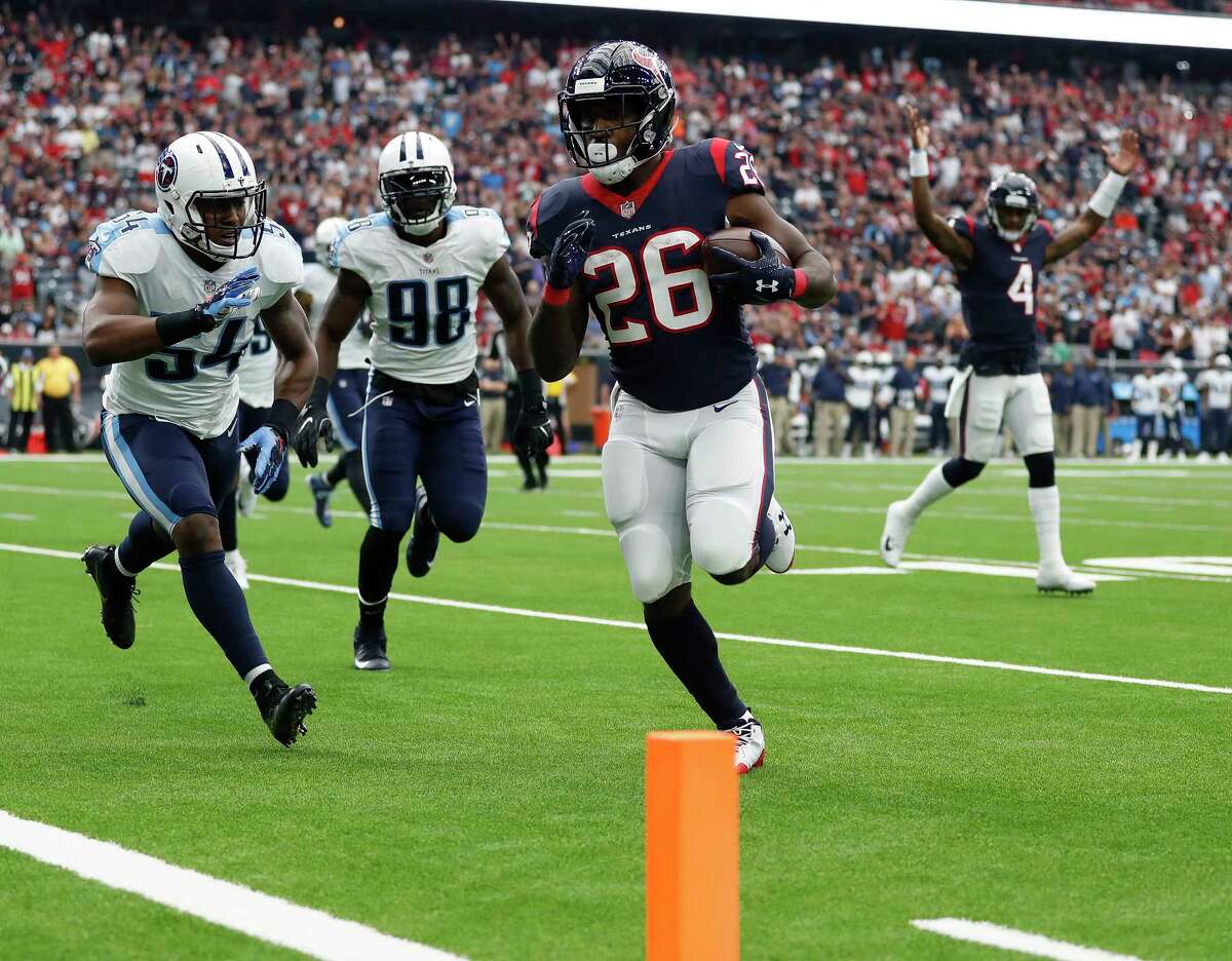 Houston Texans running back Lamar Miller (26) catches a pass from quarterback Deshaun Watson (4) on his way into the end zone for a touchdown during the first quarter of an NFL football game at NRG Stadium, Sunday, Oct. 1, 2017, in Houston. ( Karen Warren / Houston Chronicle )