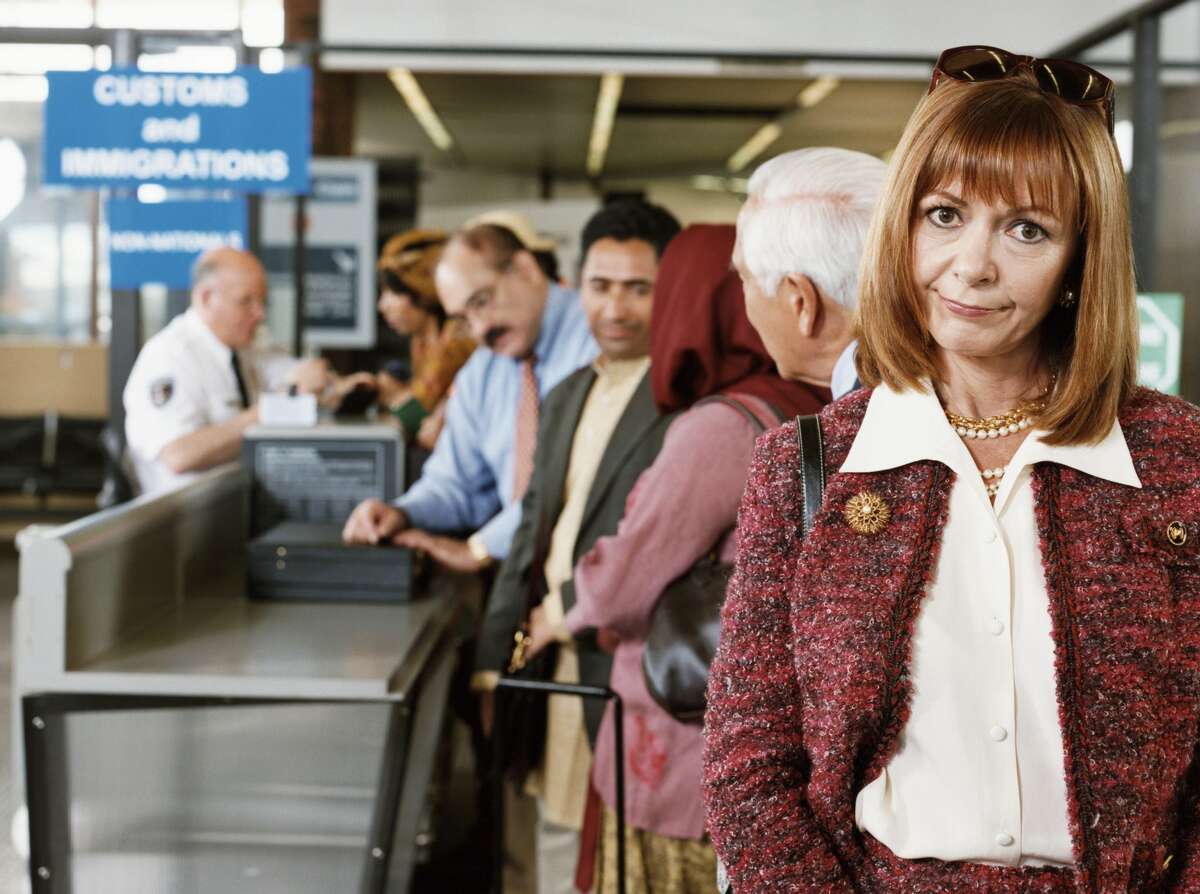 A woman isn't happy about the changes to her travel plan by a friend.