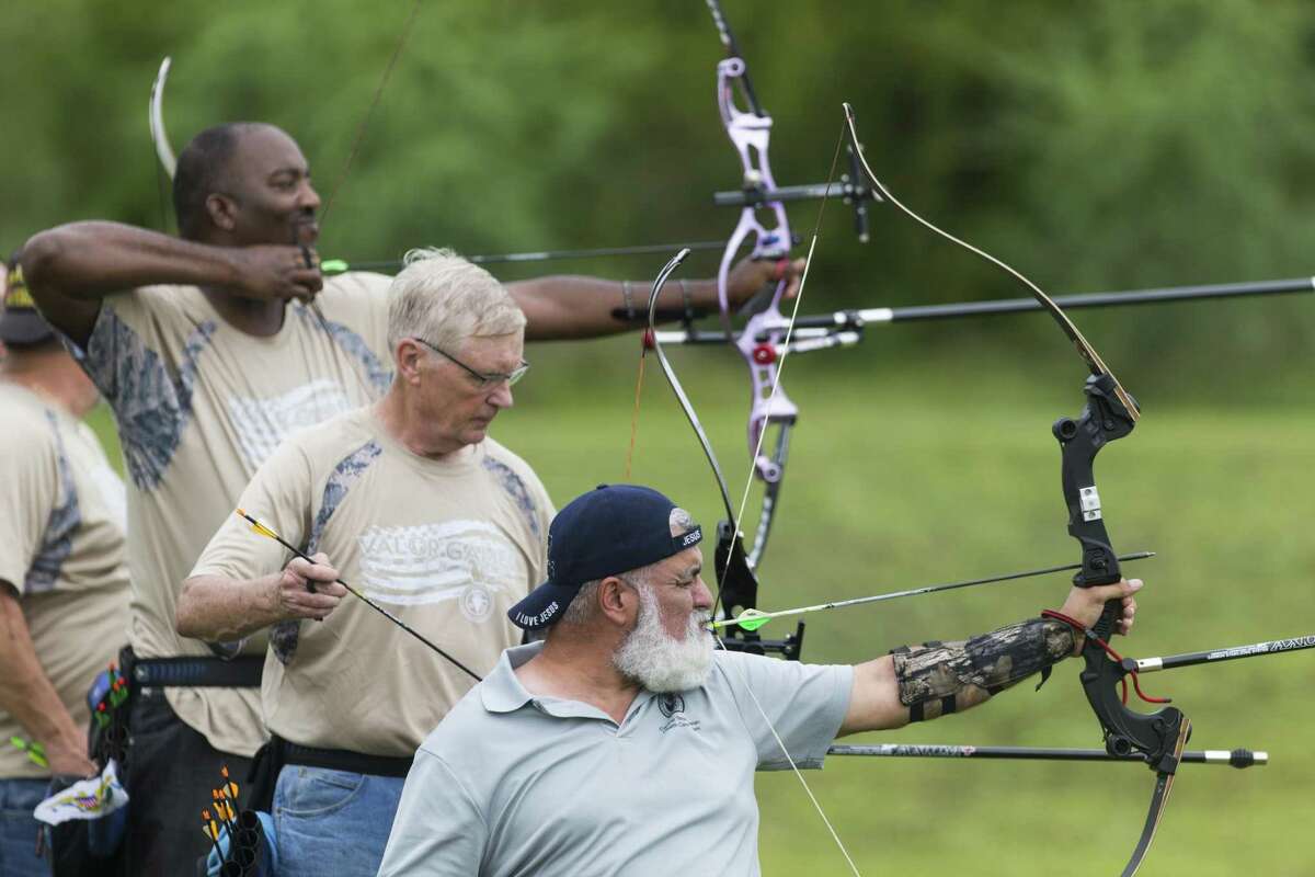 David Villarreal of Temple, from front, Don Puterbaugh of Springfield, Ohio, and Errol McKnight of St. Croix, Virgin Islands, compete Wednesday, Sept. 27, 2017 in the Valor Games 70 meter archery competition at Mission Concepci?—n Sports Park.