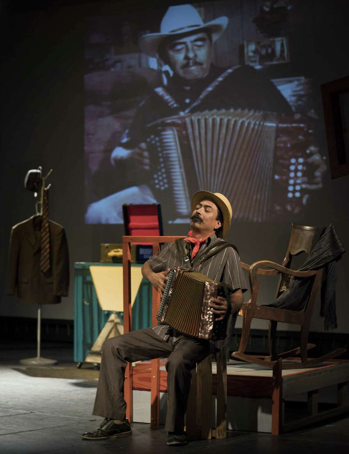 Nicolas Valdez picks up an accordion in the guise of conjunto legend Valerio Longoria during a rehearsal of “Conjunto Blues.” Valdez wrote and performs the music-laced play.