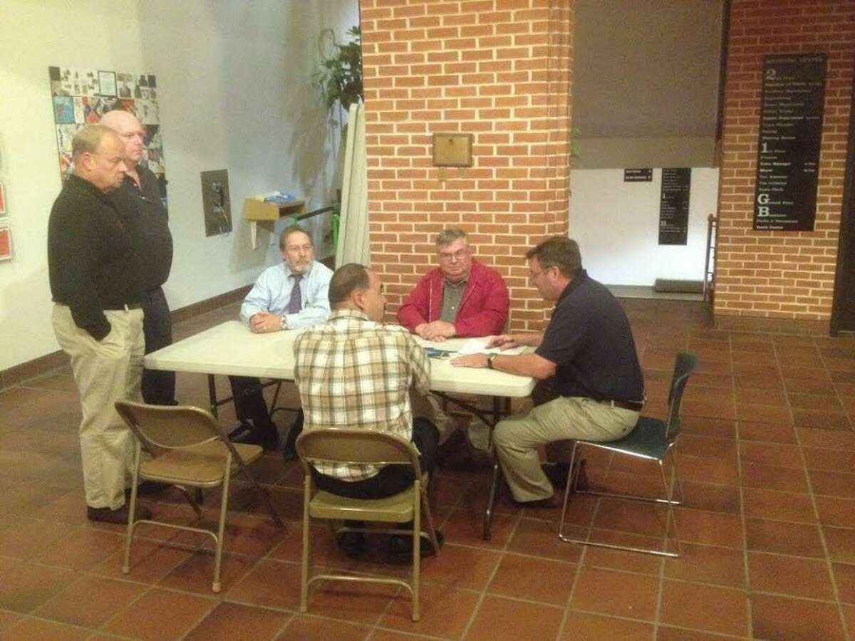 Members of the Cromwell fire district board meet following Monday's vote to elect new officers.