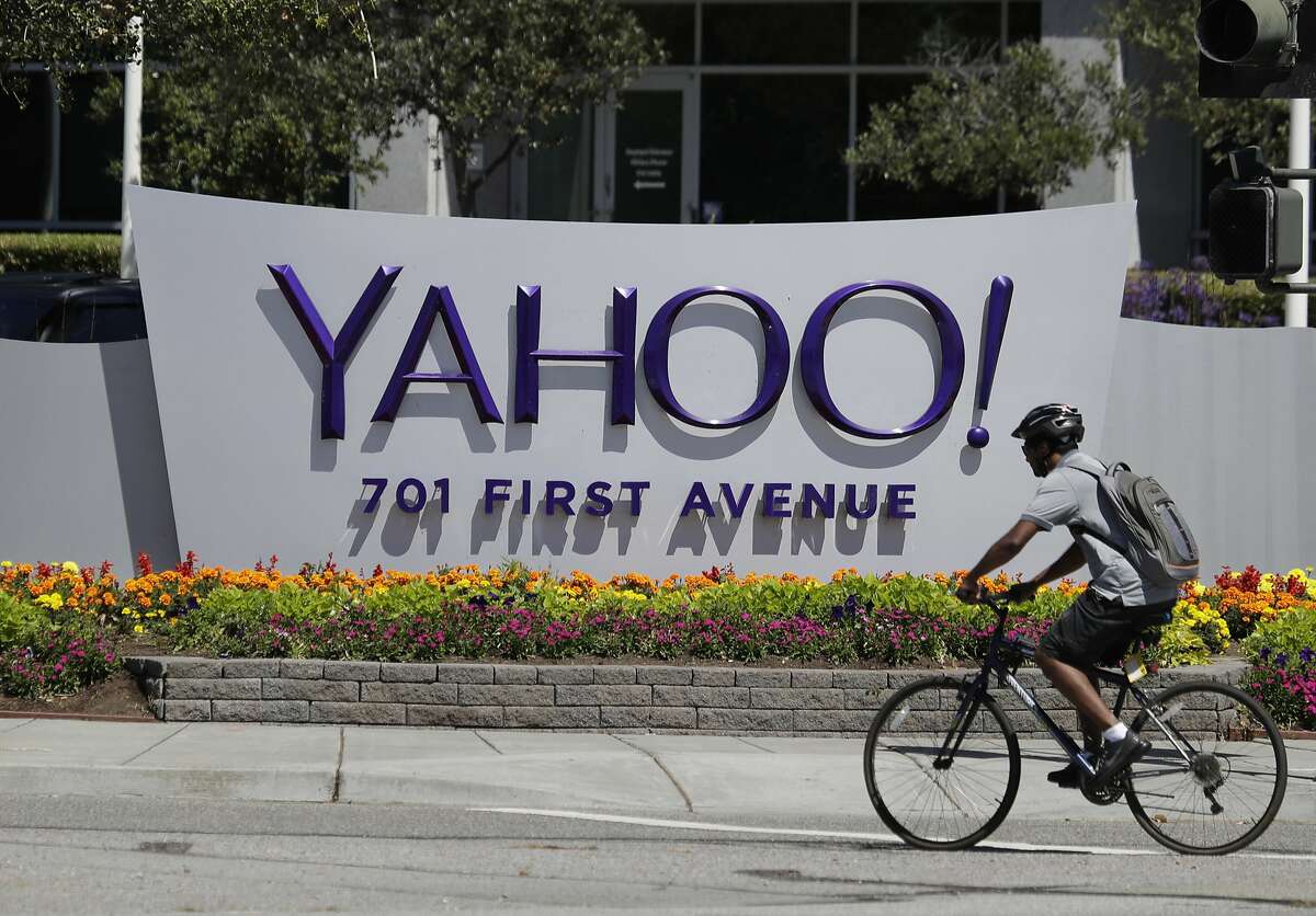 FILE - In this Tuesday, July 19, 2016 file photo, a cyclist rides past a Yahoo sign at the company's headquarters in Sunnyvale, Calif. The Yahoo hack announced Wednesday, Dec. 14, 2016 exposed personal details from more than 1 billion user accounts, potentially the largest breach of an email provider in history. (AP Photo/Marcio Jose Sanchez)