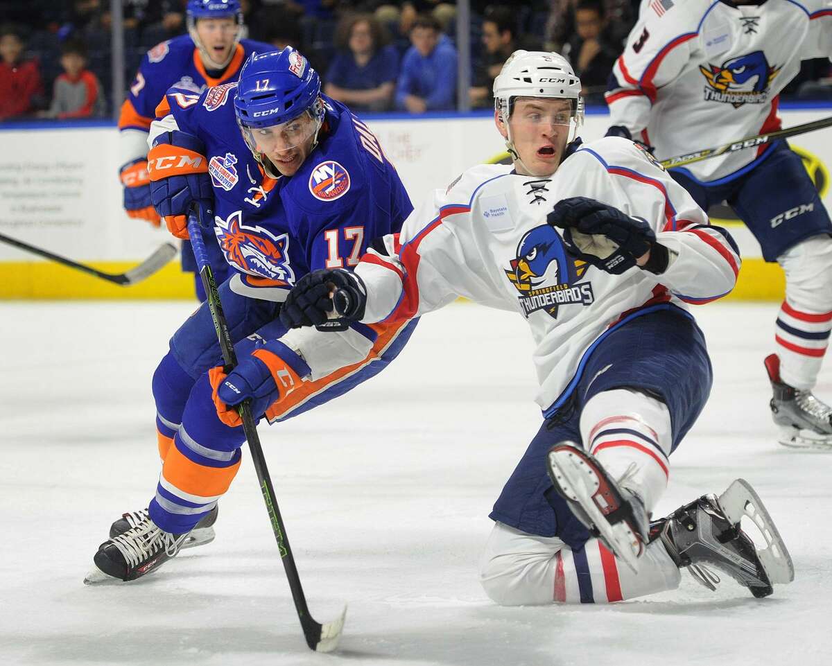 Sound Tiger Michael Dal Colle, left, is defended in front of the net by Springfield's Mike Downing during their AHL game on April 4 at the Webster Bank Arena in Bridgeport.