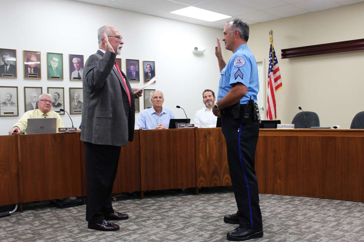 Barry Jones of the Edwardsville Police Department was sworn in by City Clerk Dennis McCracken as a new police sergeant for the city of Edwardsville at Tuesday's City Council meeting.