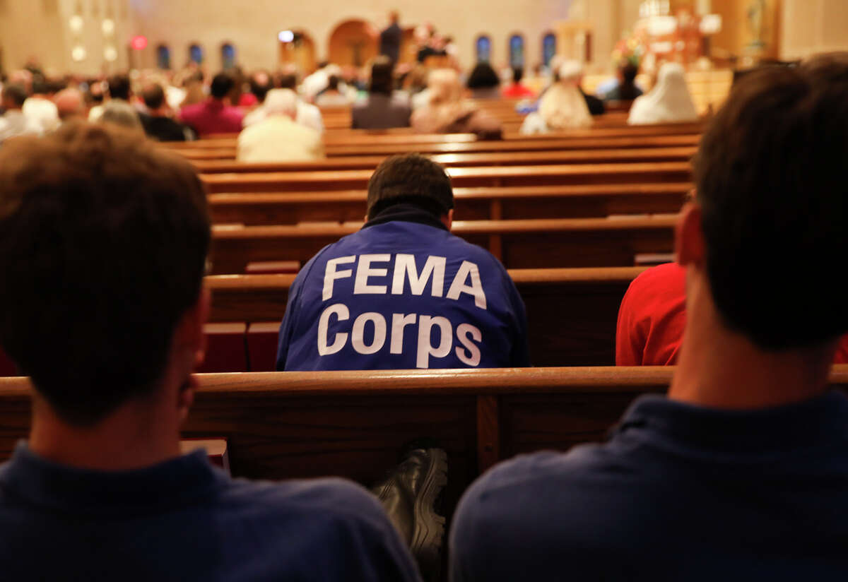 FEMA employees listen to a town hall meeting at St. John Vianney Catholic Church on Tuesday, Oct. 3, 2017, in Houston. See areas of the city hardest hit by Hurricane Harvey