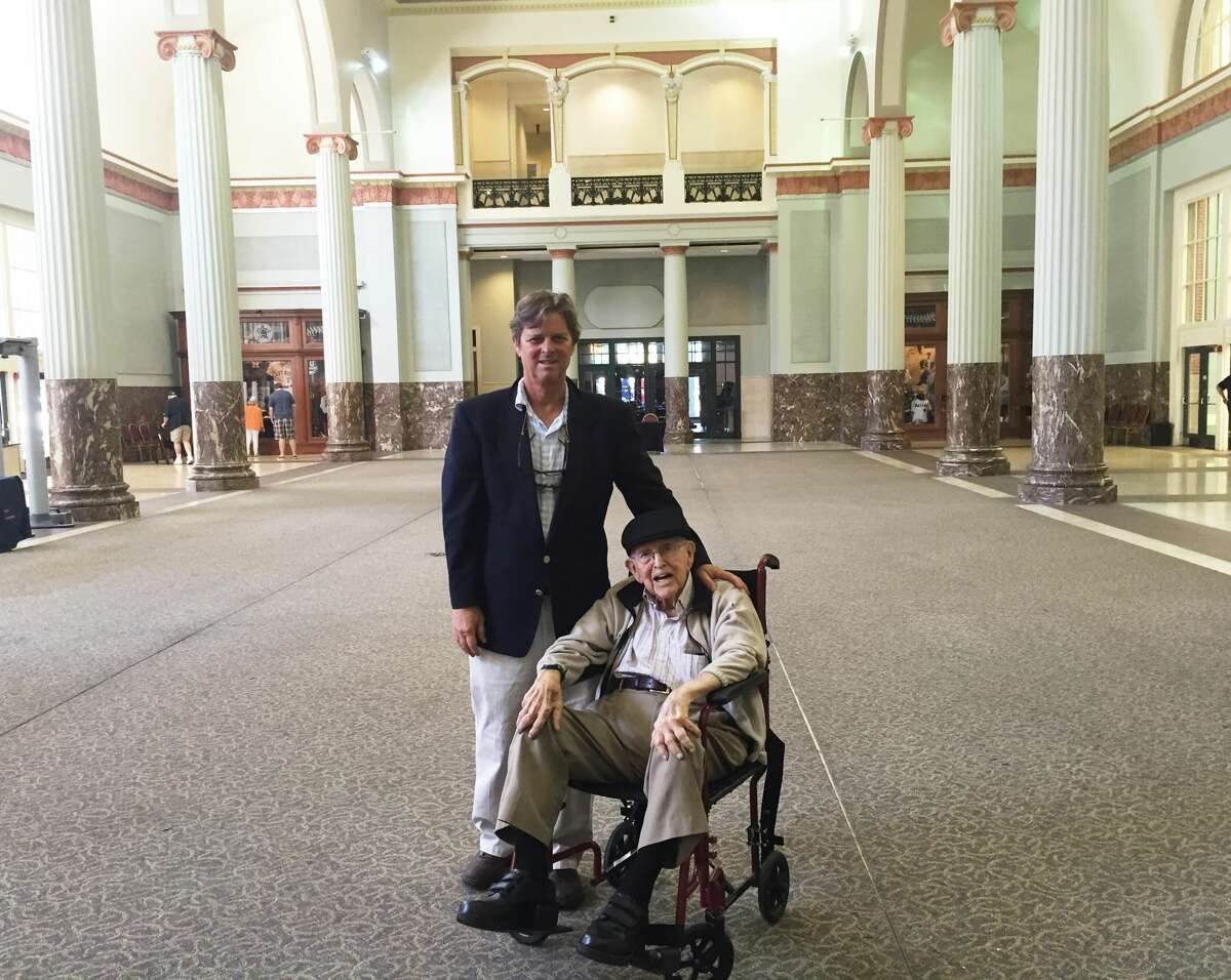 Walter Peine (right) at the entrance to Minute Maid Park in 2015 with his son Joseph Peine (right). Walter used to frequent Union Station with his mother and siblings when he was a child. 
